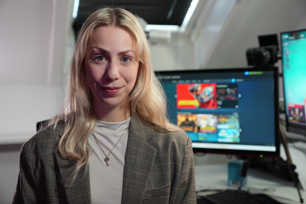 Danish video game live-streamer Marie Watson, 28, poses for a photo in her studio in Taastrup, Denmark, Thursday, Oct. 9, 2025. (AP Photo/James Brooks)