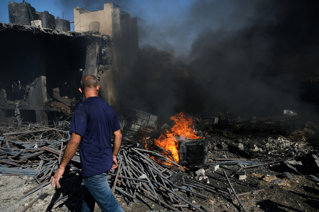 Palestinians inspect the rubble of a building destroyed in an Israeli airstrike in Gaza City, Monday, Aug. 24, 2026. (AP Photo/Jehad Alshrafi)