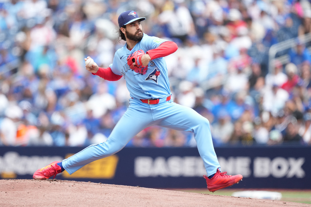 Toronto Blue Jays starting pitcher Dylan Cease works against the New York Yankees during the first inning of a baseball game in Toronto, Sunday, Aug. 16, 2026. (Nathan Denette/The Canadian Press via AP)