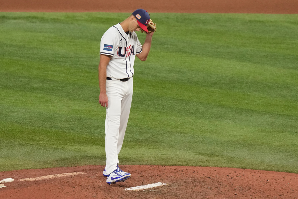 United States pitcher Tyler Rogers walks the pitchers mound during the ninth inning in the championship game of the World Baseball Classic against Venezuela, Tuesday, March 17, 2026, in Miami. (AP Photo/Lynne Sladky)