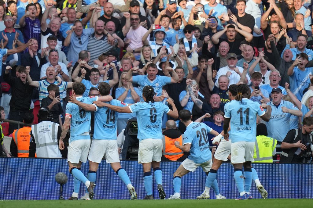 Manchester City players celebrate after scoring during the FA Cup semifinal soccer match between Manchester City and Southampton in Manchester, England, Saturday, April 25, 2026. (AP Photo/Alastair Grant)