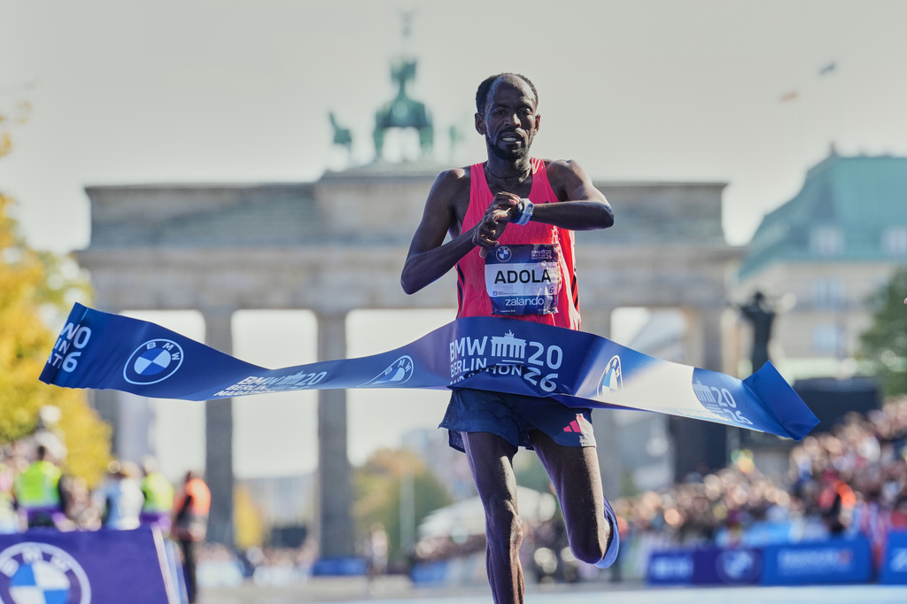 Ethiopia's Guye Adola crosses the finish line to win he Berlin Marathon in Berlin, Germany, Sunday, Sept. 27, 2026. (AP Photo/Ebrahim Noroozi)