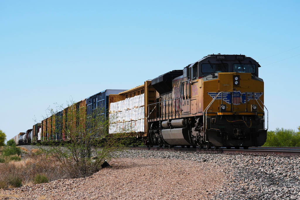 FILE - A Union Pacific freight train idles on the track as it waits to continue moving, Thursday, April 17, 2025, in Red Rock, Ariz. (AP Photo/Ross D. Franklin, File)