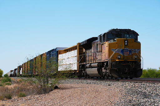 FILE - A Union Pacific freight train idles on the track as it waits to continue moving, Thursday, April 17, 2025, in Red Rock, Ariz. (AP Photo/Ross D. Franklin, File) FILE - A Union Pacific freight train idles on the track as it waits to continue moving, Thursday, April 17, 2025, in Red Rock, Ariz. (AP Photo/Ross D. Franklin, File)