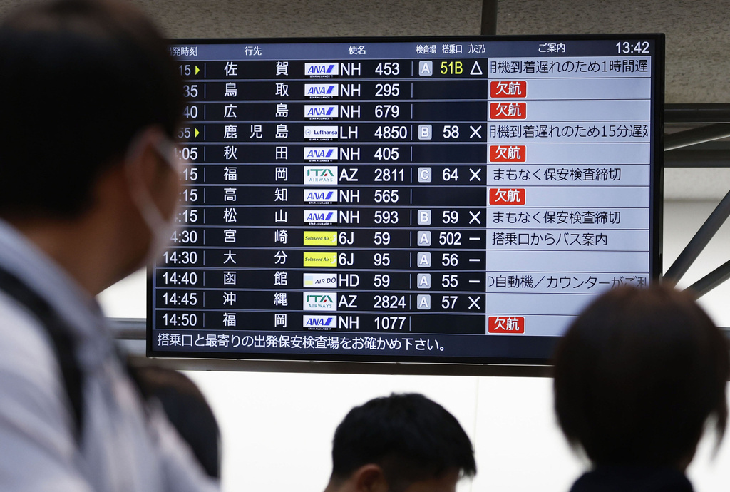 The departures display board shows All Nippon Airways' multipule flights cancellation at Haneda airport in Tokyo Saturday, Nov. 29, 2025. (Takahiko Kanbara/Kyodo News via AP)