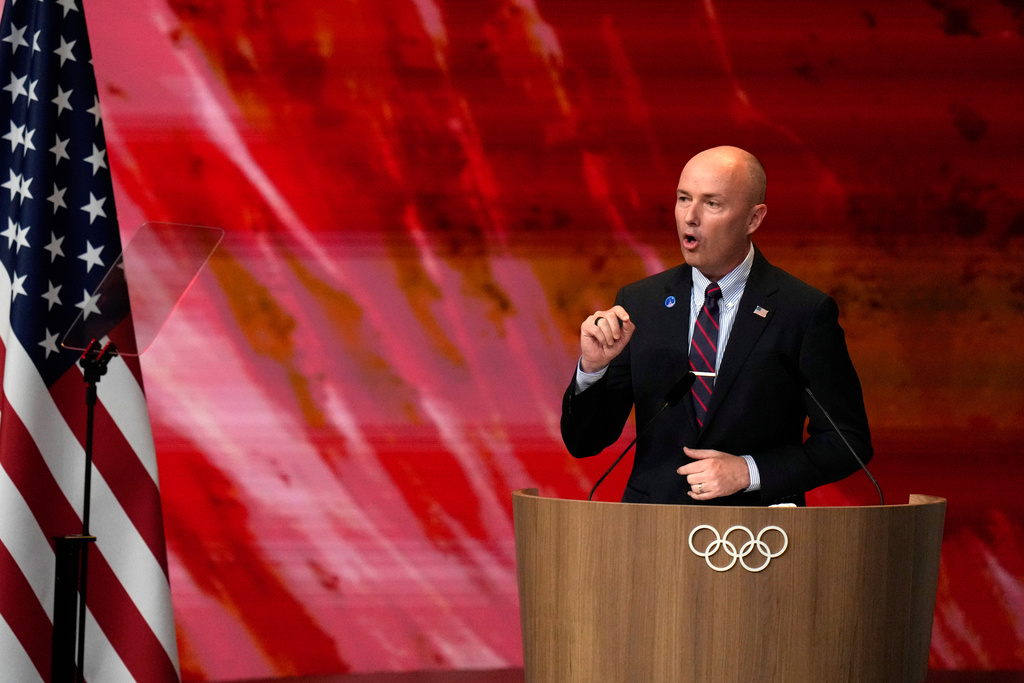FILE - Utah Gov. Spencer Cox speaks about Salt Lake City's bid to host the 2034 Winter Olympics, during the 142nd IOC session at the 2024 Summer Olympics, Wednesday, July 24, 2024, in Paris, France. (AP Photo/Natacha Pisarenko, File)