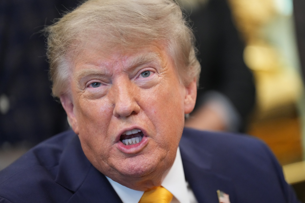President Donald Trump speaks and announces action to help farmers and ranchers with meat processing, as a group of farmers and ranchers stand behind, Friday, Sept. 4, 2026, in the Oval Office of the White House, in Washington. (AP Photo/Jacquelyn Martin)