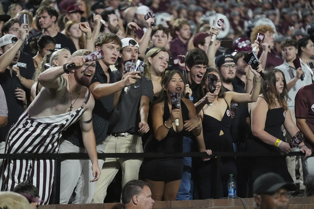 Mississippi State fans react to the team winning an NCAA college football game against Arizona State in Starkville, Miss., Saturday, Sept. 6, 2025. (AP Photo/Rogelio V. Solis)
