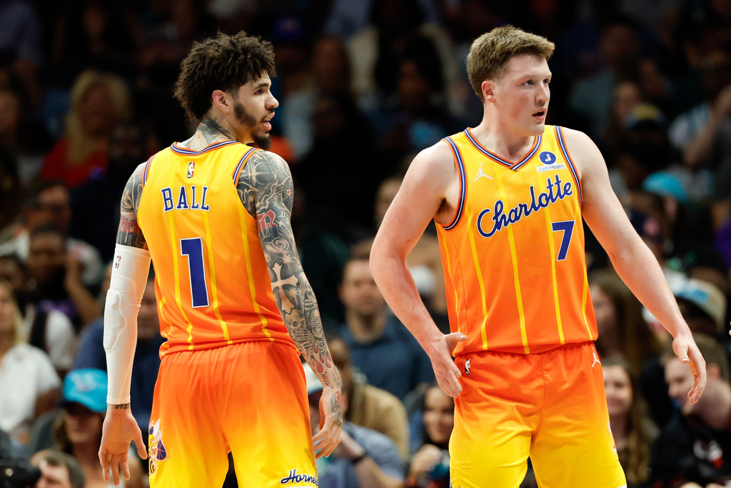 Charlotte Hornets guard LaMelo Ball (1) and guard Kon Knueppel (7) stand on the court during the first half of an NBA basketball game against the Detroit Pistons in Charlotte, N.C., Friday, April 10, 2026. (AP Photo/Nell Redmond)