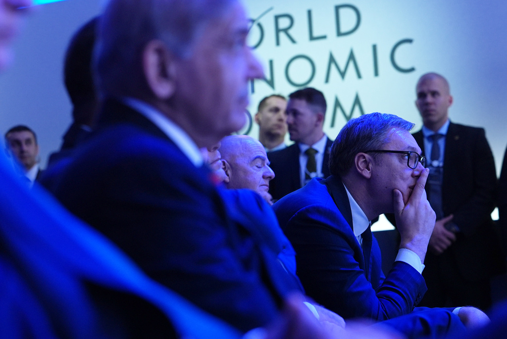 Audience members listen to the address of President Donald Trump during the Annual Meeting of the World Economic Forum in Davos, Switzerland, Wednesday, Jan. 21, 2026. (AP Photo/Evan Vucci)