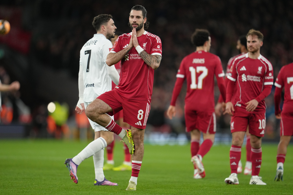 Liverpool's Dominik Szoboszlai reacts after scoring during the FA Cup third round soccer match between Liverpool and Barnsley in Liverpool, England, Monday, Jan. 12, 2026. (AP Photo/Jon Super)