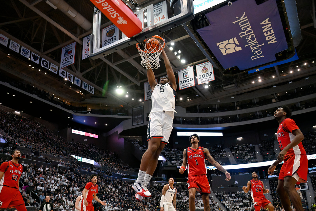 UConn forward Tarris Reed Jr. (5) dunks the ball in the first half of an NCAA college basketball game against St. John's, Wednesday, Feb. 25, 2026, in Hartford, Conn. (AP Photo/Jessica Hill)