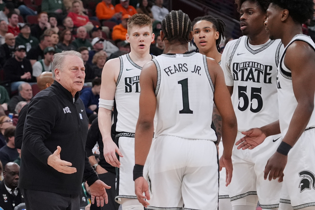 Michigan State head coach Tom Izzo, left, talks to his team during the first half of an NCAA college basketball game against UCLA in the quarterfinals of the Big 10 Conference tournament, Friday, March 13, 2026, in Chicago. (AP Photo/Nam Y. Huh)