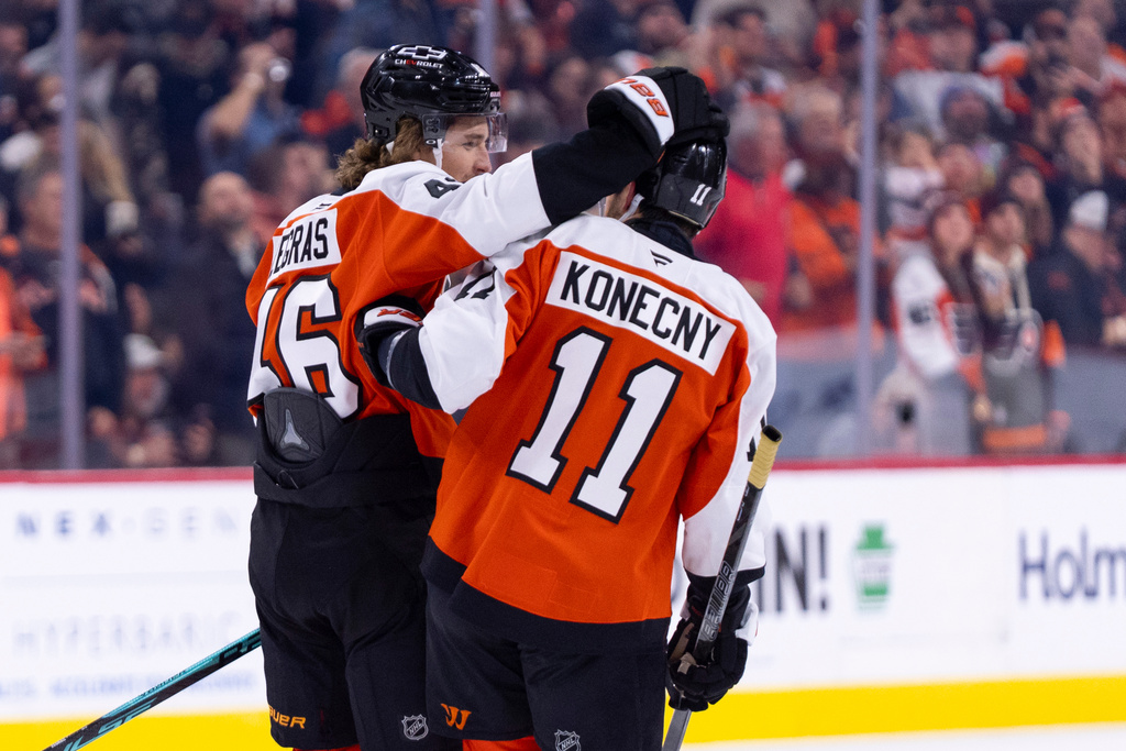 Philadelphia Flyers' Trevor Zegras, left, celebrates with Travis Konecny, right, after scoring his second goal of the period during the first period of an NHL hockey game against the Anaheim Ducks, Tuesday, Jan. 6, 2026, in Philadelphia. (AP Photo/Chris Szagola)