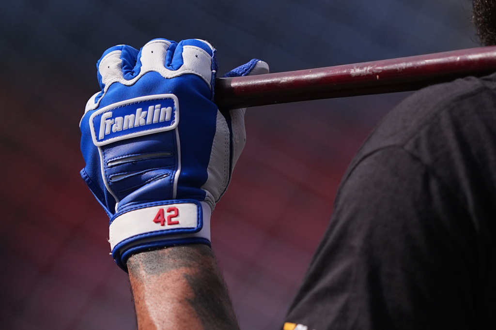 Philadelphia Phillies' Edmundo Sosa, wearing No. 42 to commemorate Jackie Robinson Day, takes batting practice ahead of a baseball game against the Chicago Cubs, Wednesday, April 15, 2026, in Philadelphia. (AP Photo/Matt Rourke)