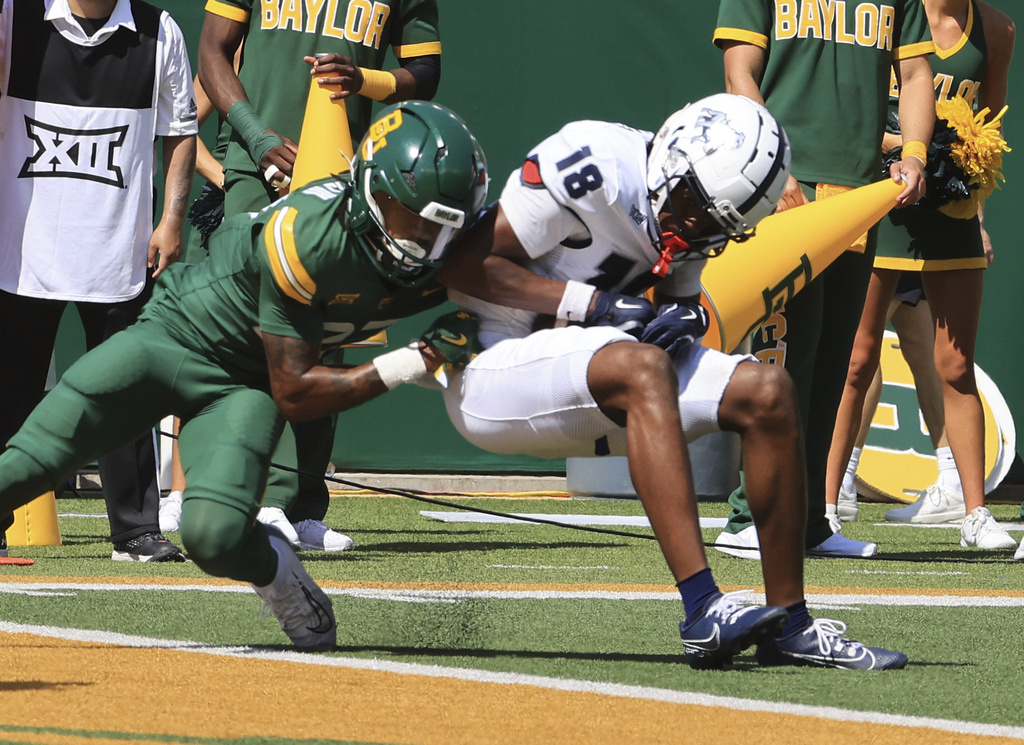 Samford's wide receiver Torrey Ward scores Baylor's cornerback Tevin Williams III in the first half of an NCAA college football game, Saturday, Sept. 13, 2025, in Waco, Texas. (Jerry Larson/Waco Tribune-Herald via AP)