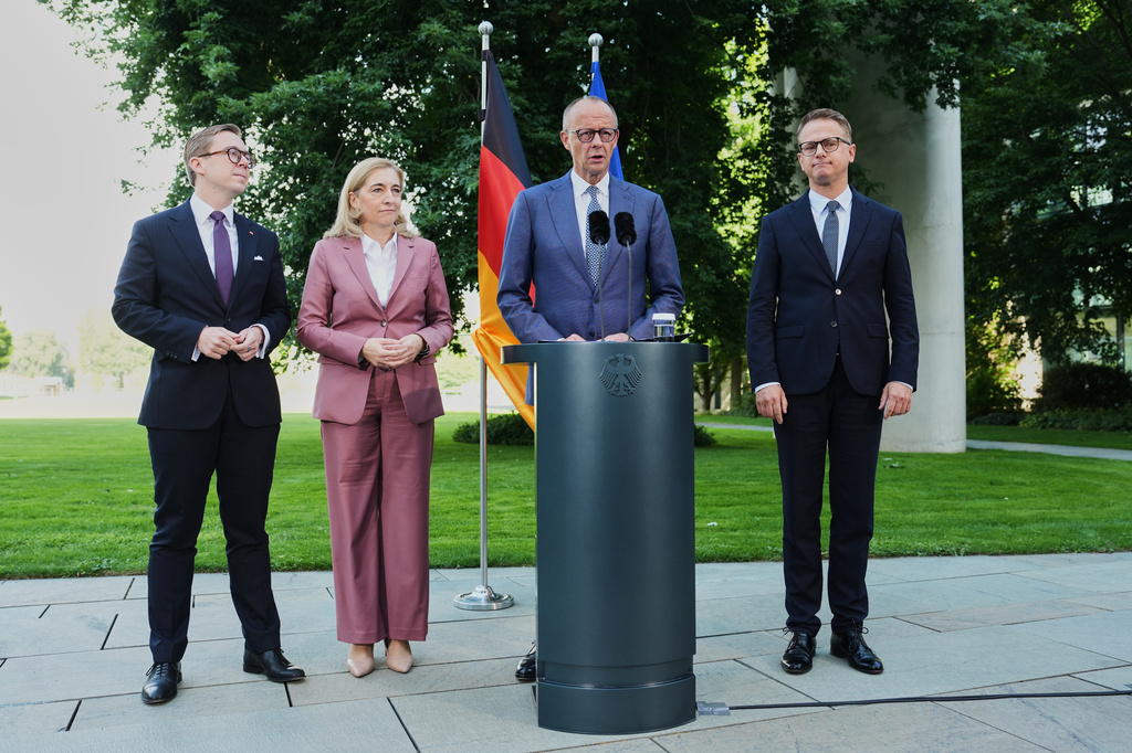 From left: Federal Chancellor Friedrich Merz arrives with Philipp Amthor, Nina Warken and Carsten Linnemann and for statement about planned personnel changes in his government at the chancellery in Berlin, Germany, Friday, July 24, 2026. (AP Photo/Markus Schreiber)