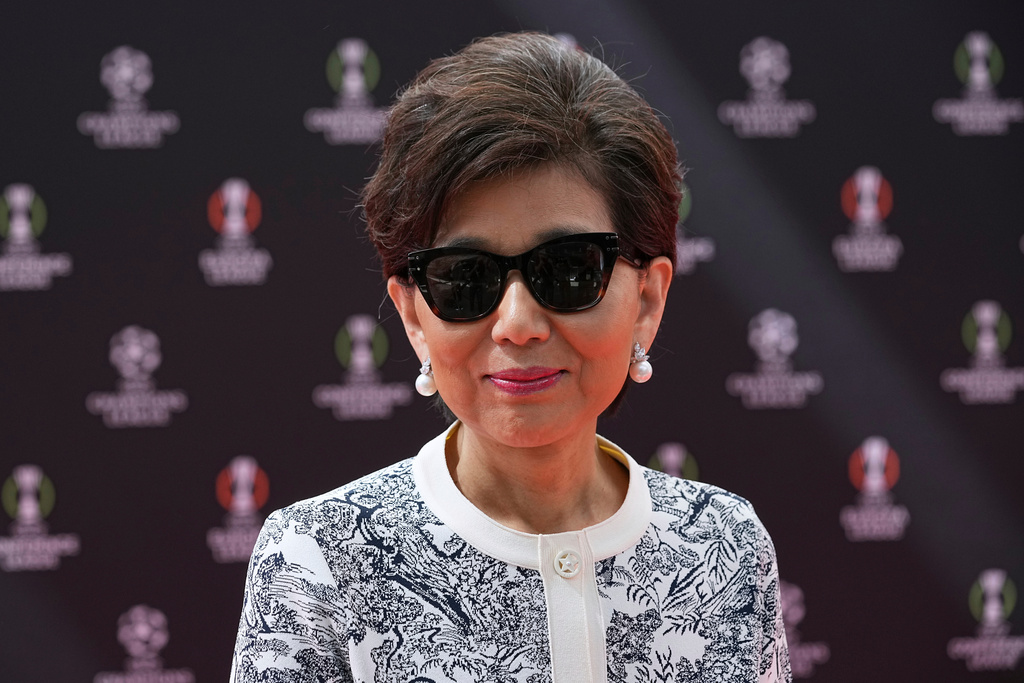 FILE 0 American businesswoman Michele Kang, owner of Olympique Lyonnais, arrives for the Europa League soccer league phase draw in Monaco, Friday, Aug. 29, 2025. (AP Photo/Laurent Cipriani, File)
