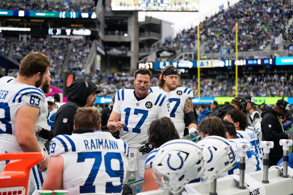 Indianapolis Colts quarterback Philip Rivers (17) talks with teammates during the first half of an NFL football game against the Seattle Seahawks, Sunday, Dec. 14, 2025, in Seattle. (AP Photo/Stephen Brashear)