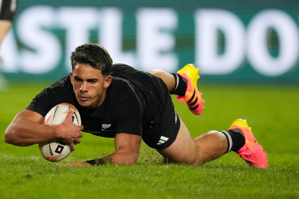 New Zealand's Noah Hotham scores a try during an international friendly rugby match between Lions and New Zealand, in Johannesburg, South Africa, Tuesday, Aug. 25, 2026. (AP Photo/Themba Hadebe)
