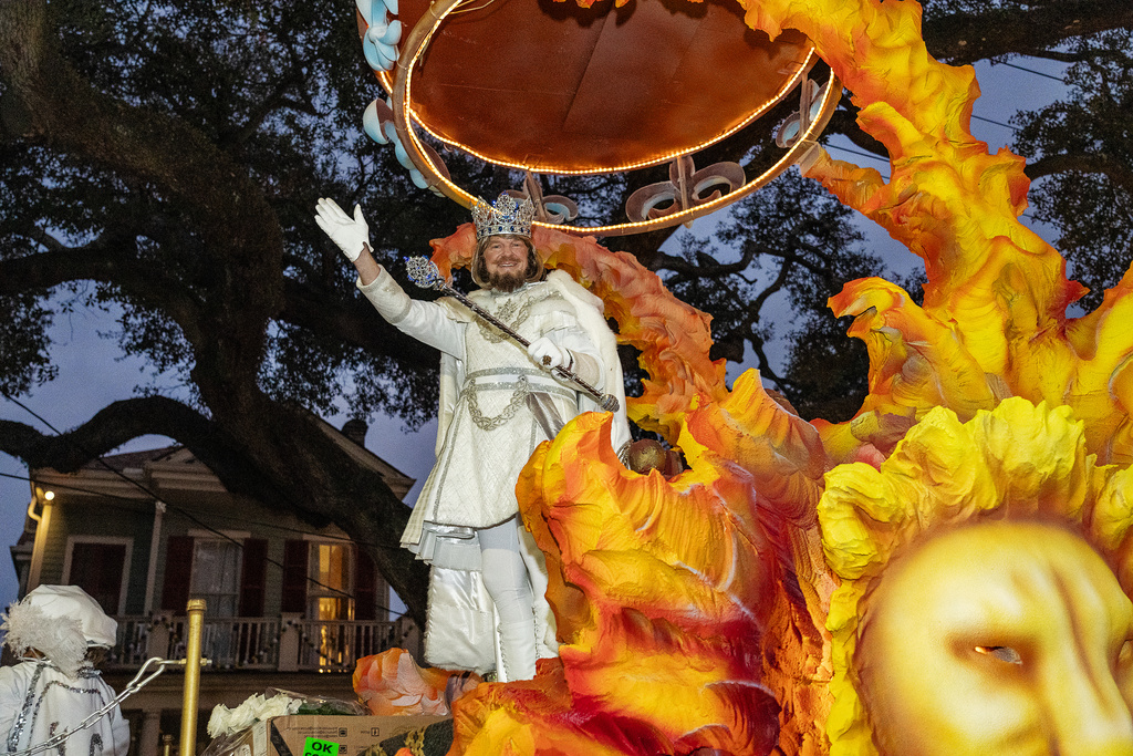 Attendees participate in the annual Krewe of Hermes Parade during the Mardi Gras season on Friday, Feb. 13, 2026, in New Orleans. (Photo by Amy Harris/Invision/AP)