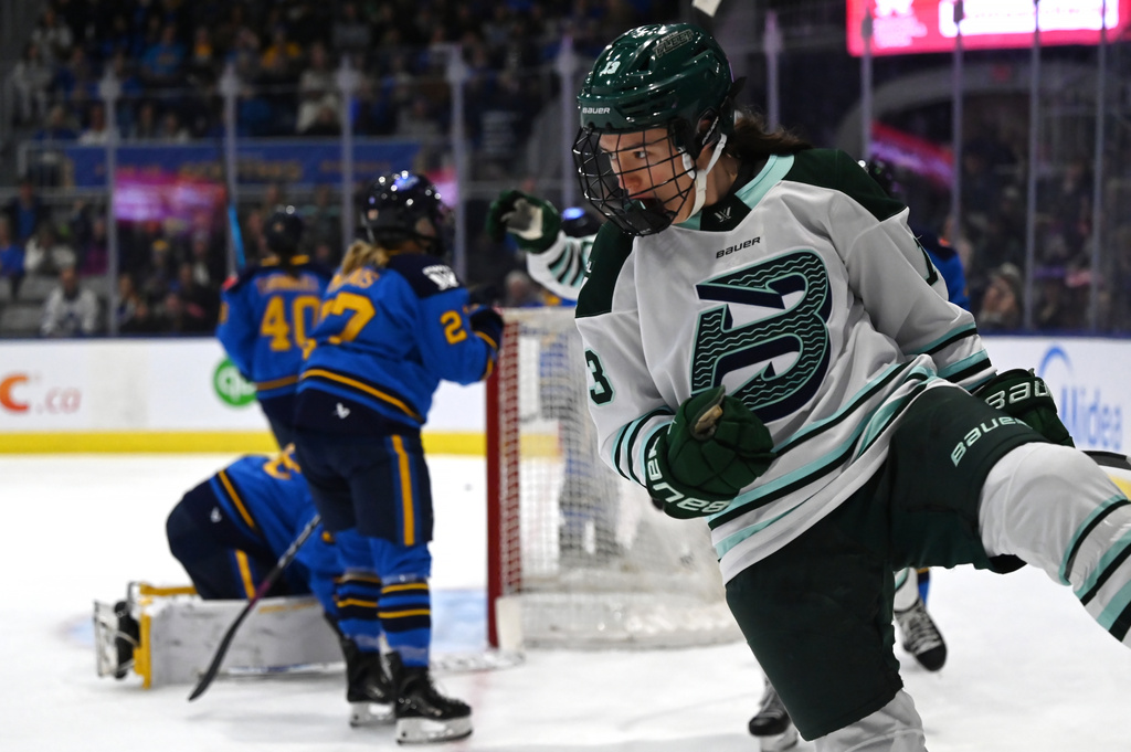 Boston Fleet's Liz Schepers (13) celebrates after scoring against Toronto Sceptres goaltender Elaine Chuli, left, during first-period PWHL hockey game action in Toronto, Friday, March 27, 2026. (Jon Blacker/The Canadian Press via AP)