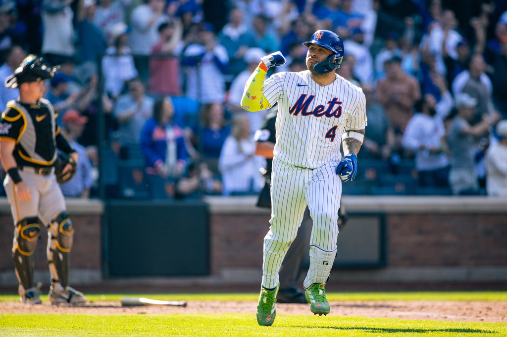 New York Mets catcher Francisco Alvarez (4) celebrates a home run during the sixth inning of an opening-day baseball game against the Pittsburgh Pirates, Thursday, March 26, 2026, in New York. (AP Photo/Angelina Katsanis)