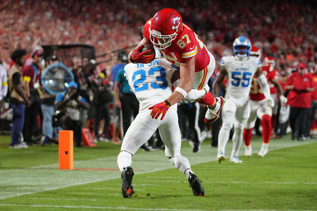 Kansas City Chiefs tight end Travis Kelce (87) is upended short of the end zone by Detroit Lions cornerback Rock Ya-Sin (23) during the first half of an NFL football game Sunday, Oct. 12, 2025, in Kansas City, Mo. (AP Photo/Ed Zurga)
