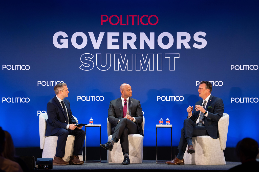 Politico Correspondent Adam Wren, Gov. Wes Moore, D-Md., and Gov. Kevin Stitt, R-Okla., participate at an event at the National Governors Association Winter Meeting, Thursday, Feb. 19, 2026, in Washington. (AP Photo/Allison Robbert)