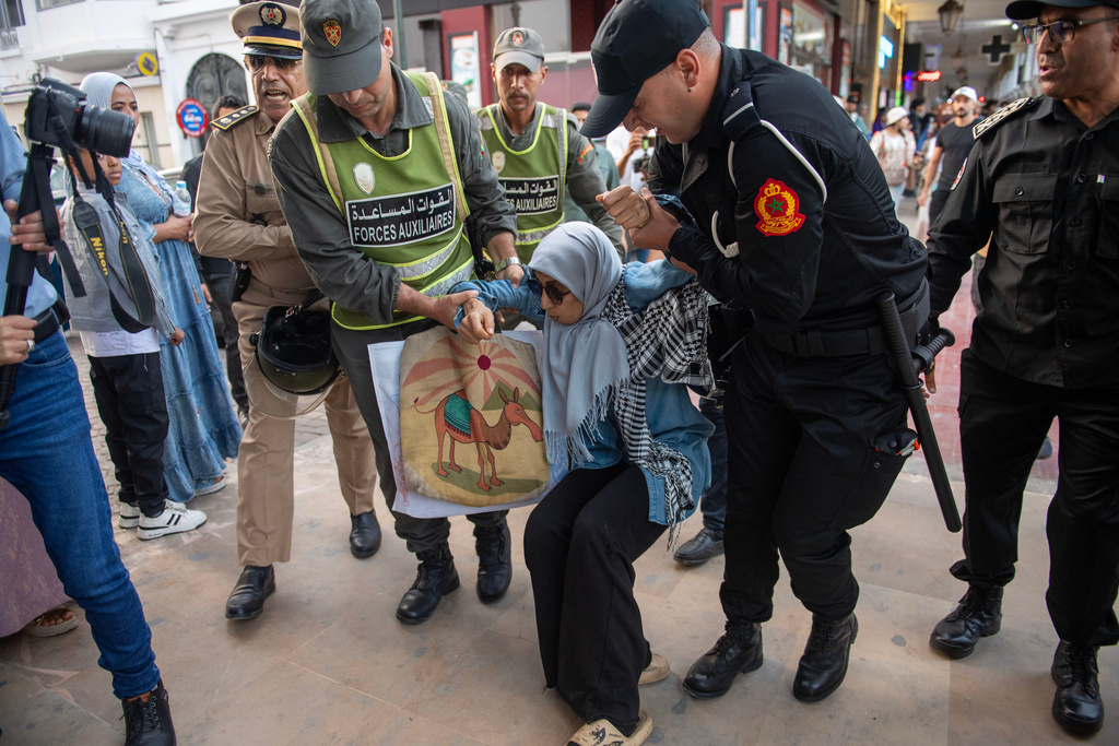 Security forces disperse and arrest protesters during a demonstration demanding healthcare and education reforms, in Rabat, Morocco, on Saturday, Sept. 27, 2025. (AP Photo)