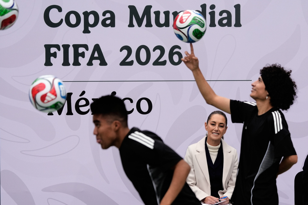Mexican President Claudia Sheinbaum watches a performance during her daily press conference that focuses on the 2026 FIFA World Cup, which Mexico will co-host with the U.S. and Canada, at the Los Pinos Cultural Complex in Mexico City, Monday, Nov. 10, 2025. (AP Photo/Marco Ugarte)