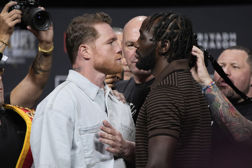 FILE - Canelo Alvarez, left, and Terence Crawford face off during a news conference for their upcoming boxing match Friday, June 27, 2025, in Las Vegas. (AP Photo/John Locher, File)
