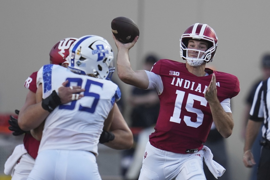 Indiana quarterback Fernando Mendoza (15) throws against Indiana State during the first half of an NCAA college football game, Friday, Sept. 12, 2025, in Bloomington, Ind. (AP Photo/Darron Cummings)