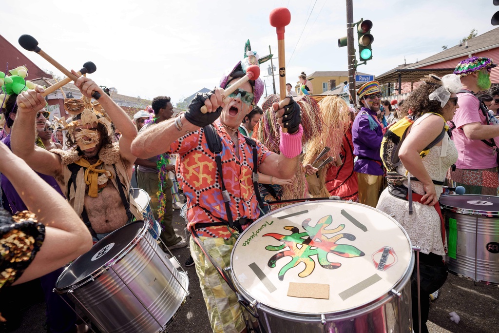 People participating in the Society of Saint Anne parade wander through the Bywater and Marigny neighborhoods on Mardi Gras Day, Tuesday, Feb. 17, 2026 in New Orleans. (AP Photo/Matthew Hinton)