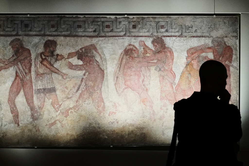 "Mastarna (the future king Servius Tullius) rescues Caelius Vibenna" a fresco dating from 330–310 B.C., is exhibited in the reconstruction of the François Tomb, an Etruscan tomb, at the Villa Giulia Etruscan Museum in Rome, Tuesday, June 30, 2026. (AP Photo/Alessandra Tarantino)