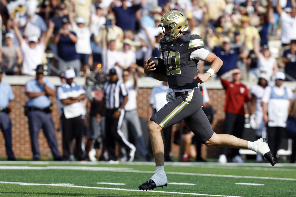 Georgia Tech quarterback Haynes King carries the ball in for a touchdown against Temple during the first half of an NCAA college football game, Saturday, Sept. 20, 2025, in Atlanta. (AP Photo/Butch Dill)