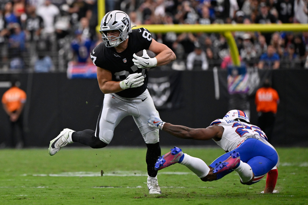 Las Vegas Raiders tight end Michael Mayer (87) makes a catch in front of Buffalo Bills safety C.J. Gardner-Johnson (22) during an NFL football game in Las Vegas, Sunday, Oct. 18, 2026. (AP Photo/David Becker)
