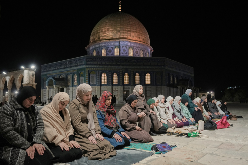 Muslim worshippers perform the evening Tarawih prayers during the holy fasting month of Ramadan, next to the Dome of Rock shrine at the Al-Aqsa Mosque compound in Jerusalem's Old City, Tuesday, Feb. 17, 2026. (AP Photo/Mahmoud Illean)
