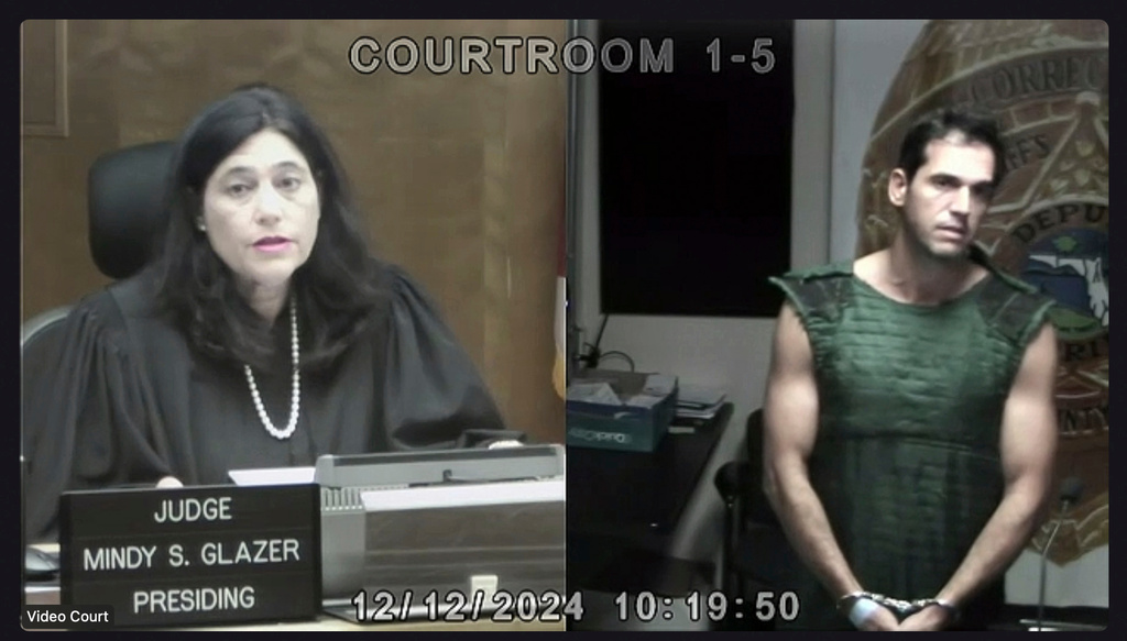 FILE - In this screenshot, Miami Dade Circuit Court Judge Mindy S. Glazer is seen via video presiding over the first court appearance of Alon Alexander, who is charged with sexual battery along with his twin brother, Oren Alexander, on Thursday, Dec. 12, 2024, in Miami. (Miami Dade Circuit Court via AP, Pool, File)