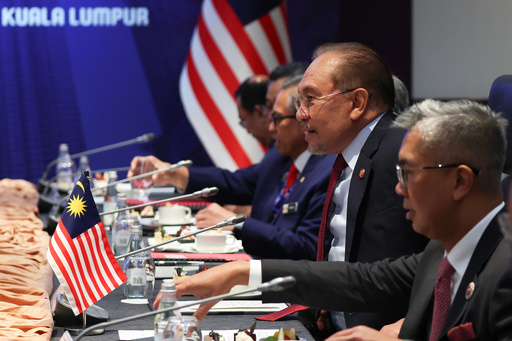 Malaysia's Prime Minister Anwar Ibrahim, second right, meets with Canada's Prime Minister Mark Carney, during a bilateral meeting on the sidelines of the Association of Southeast Asian Nations (ASEAN) Summit at the Kuala Lumpur Convention Centre (KLCC) in Kuala Lumpur, Malaysia, Monday, Oct. 27, 2025. (Fazry Ismail/Pool Photo via AP) Malaysia's Prime Minister Anwar Ibrahim, second right, meets with Canada's Prime Minister Mark Carney, during a bilateral meeting on the sidelines of the Association of Southeast Asian Nations (ASEAN) Summit at the Kuala Lumpur Convention Centre (KLCC) in Kuala Lumpur, Malaysia, Monday, Oct. 27, 2025. (Fazry Ismail/Pool Photo via AP)