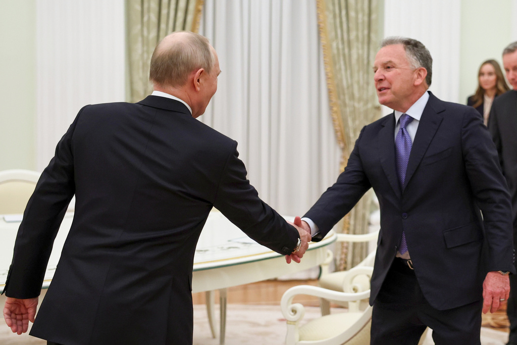 Russian President Vladimir Putin, left, greets U.S. President Donald Trump's envoys Steve Witkoff at the Senate Palace of the Kremlin, in Moscow, Thursday, Jan. 22, 2026. (Alexander Kazakov/Sputnik, Kremlin Pool Photo via AP)