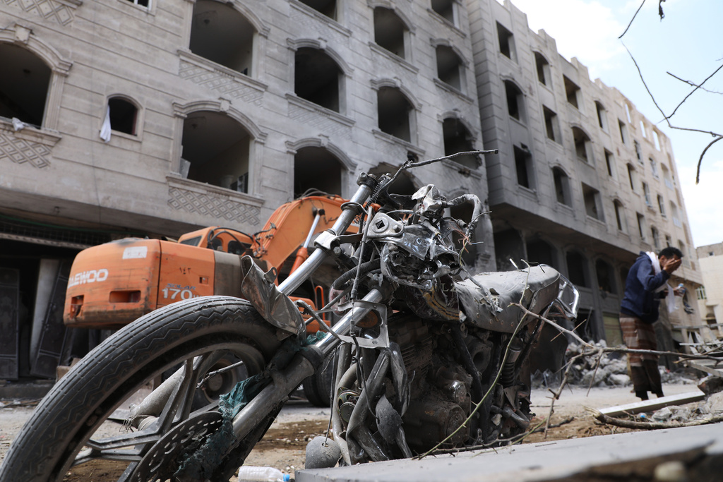 A Yemeni man washes his face next to his damaged motorbike following Israeli airstrikes in Sanaa, Yemen, Friday, Sept. 26, 2025. (AP Photo)