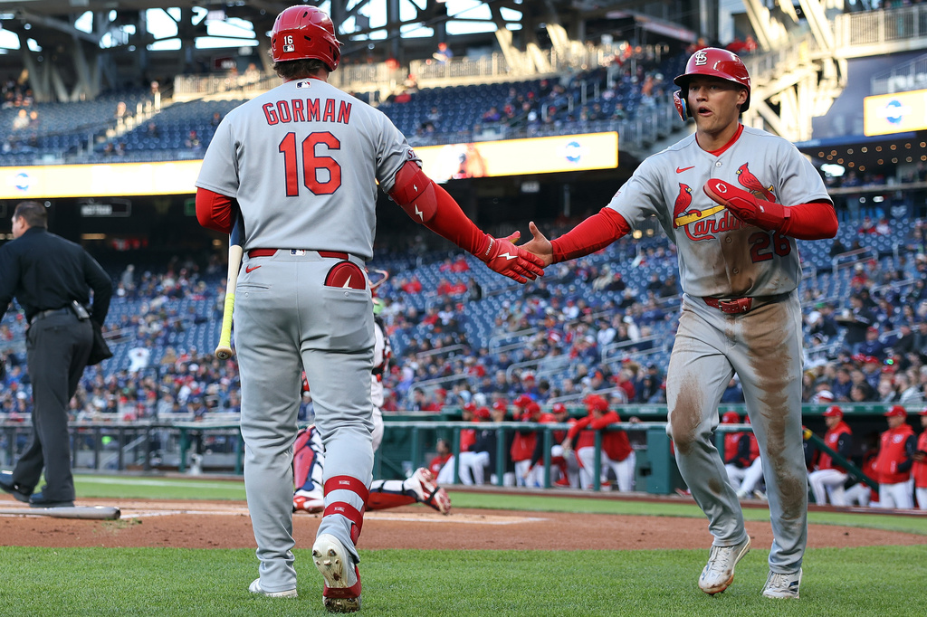 St. Louis Cardinals' JJ Wetherholt celebrates with St. Louis Cardinals' Nolan Gorman after scoring a run during the first inning of a baseball game against the Washington Nationals, Tuesday, April 7, 2026, in Washington. (AP Photo/Daniel Kucin Jr.)