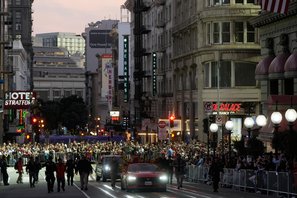 Olympic gold medalist and Grand Marhsal Eileen Gu, bottom middle, waves during the Chinese New Year Parade in San Francisco, Saturday, March 7, 2026. (AP Photo/Jeff Chiu)