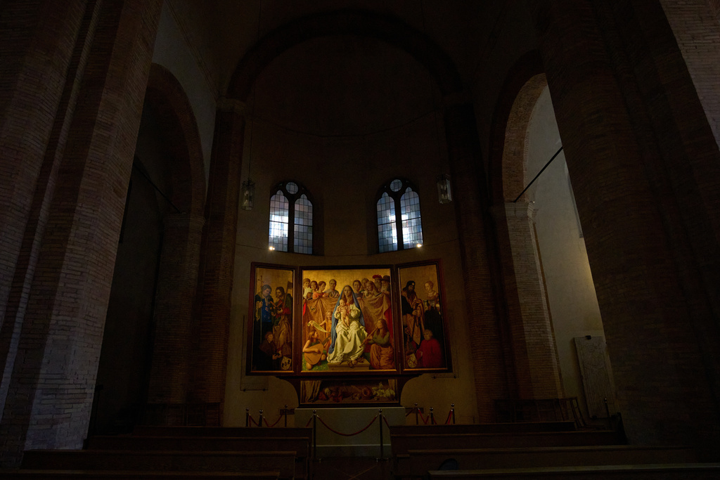 A painting, the central of the triptych, by German artist Michael Triegel who portrayed in 2018 as St. Peter Burkhard Scheffler, a homeless man who died from the cold in 2022, is displayed in the chapel of the Teutonic College at the Vatican, Wednesday, Dec. 10, 2025. (AP Photo/Alessandra Tarantino)