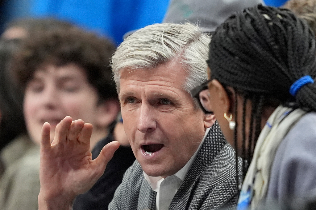 FILE - Rick Welts, center, the Dallas Mavericks newly appointed chief executive officer, attends an NBA basketball game against the Los Angeles Clippers in Dallas, Dec. 19, 2024. (AP Photo/Tony Gutierrez, File)
