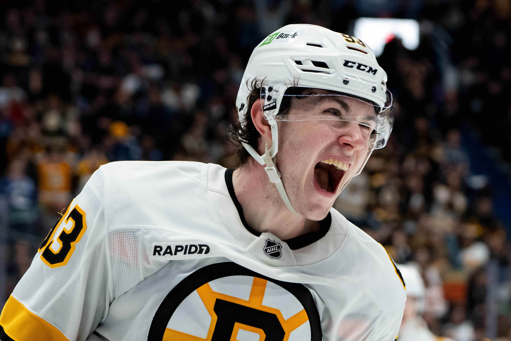 Boston Bruins' Fraser Minten (93) celebrates his game-winning goal against the Vancouver Canucks during overtime in an NHL hockey game in Vancouver, British Columbia, on Saturday, Jan. 3, 2026. (Ethan Cairns/The Canadian Press via AP)
