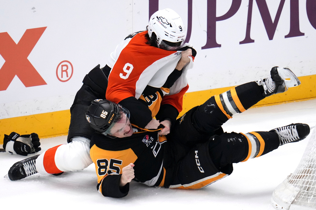 FILE - Pittsburgh Penguins' Avery Hayes (85) and Philadelphia Flyers' Jamie Drysdale (9) fight during the first period of an NHL hockey game in Pittsburgh, March 7, 2026. (AP Photo/Gene J. Puskar, File)