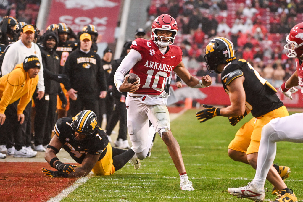 Arkansas quarterback Taylen Green (10) runs the ball against Missouri during the first half of an NCAA college football game Saturday, Nov. 29, 2025, in Fayetteville, Ark. (AP Photo/Michael Woods)