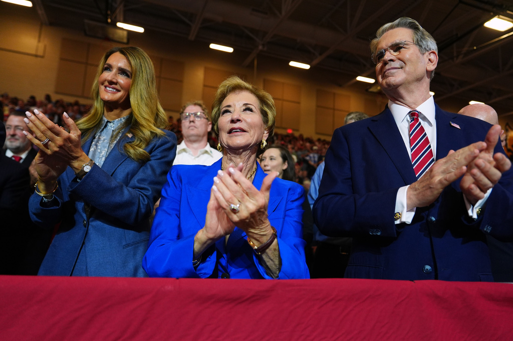 Small Business Administration Administrator Kelly Loeffler, Secretary of Education Linda McMahon and Treasury Secretary Scott Bessent applaud as President Donald Trump speaks at Wheeler High School, Wednesday, July 22, 2026, in Marietta, Ga. (AP Photo/Julia Demaree Nikhinson)